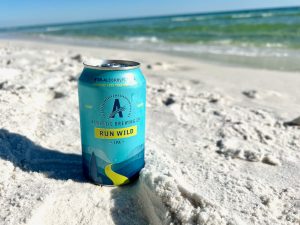 non alcoholic beer in the sand on a beach