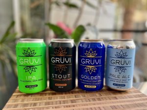 four gruvi beers on a wooden board
