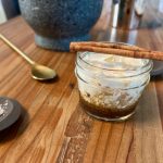 White Russian mocktail with a cinnamon stick on top